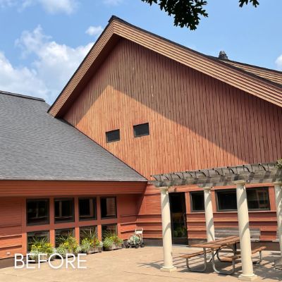 Excelsior commercial building before staining, the cedar siding weathered and uneven