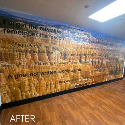 Office wall mural of canyon rock formations overlaid with lettering