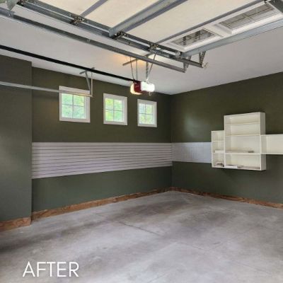 Garage interior painted olive green above a white dado