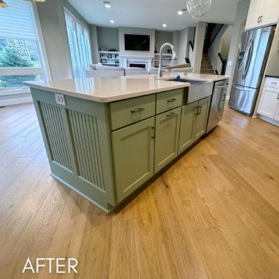 Kitchen island refinished olive green under a white quartz top