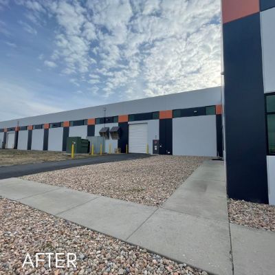 Commercial unit exterior in navy and white with orange banding