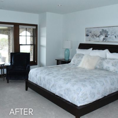 Bedroom after painting, pale walls beside a dark wood window frame