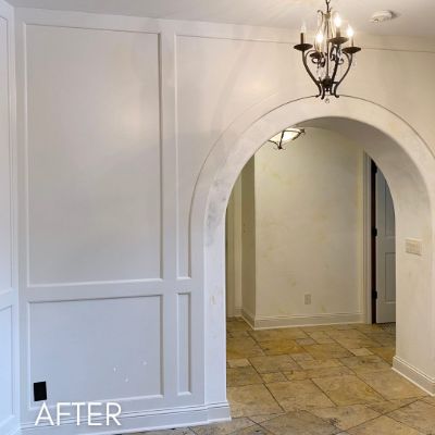 Arched doorway and wall panelling after enameling, in flat white