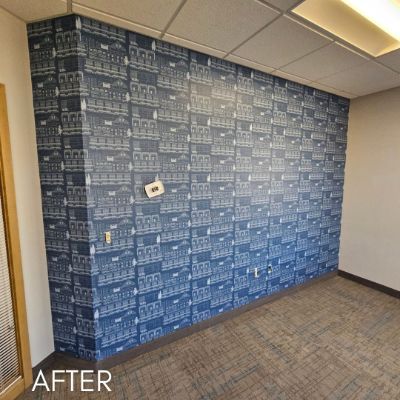 Office wall hung with a blue patterned wallcovering