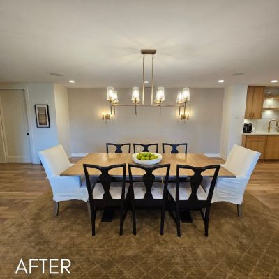 Dining room after painting, white walls and ceiling above a long oak table