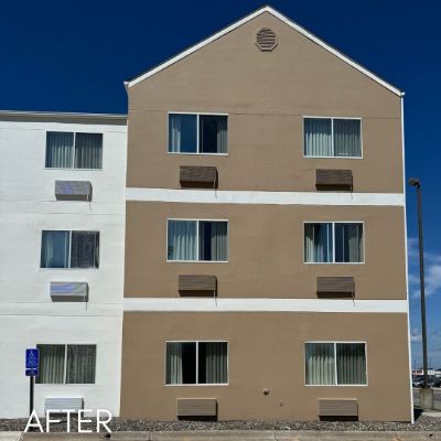 Hotel gable end painted tan with white trim