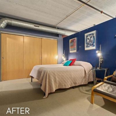 Basement bedroom after painting, with a deep blue accent wall