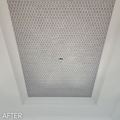 Tray ceiling papered in a fine geometric print