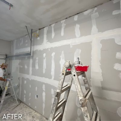 Garage interior after drywall taping, primed and ready for paint
