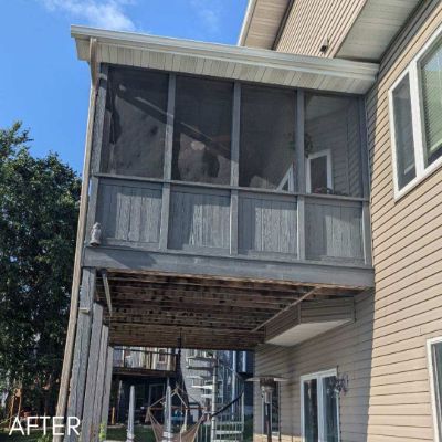 Raised screened porch in tan siding above an open deck