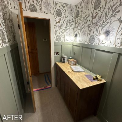 Entry papered in a botanical print above sage board and batten panelling