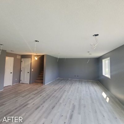 Empty basement room after painting, gray walls and white ceiling