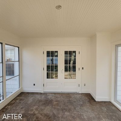 Room after painting, white walls and beadboard ceiling around french doors