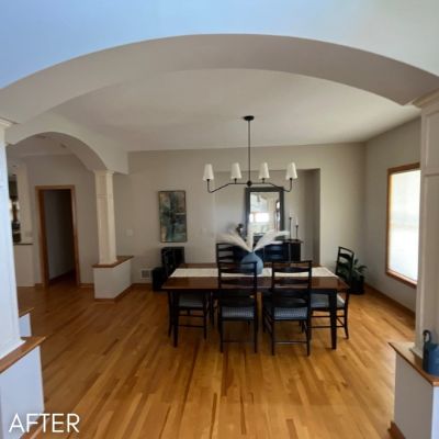 Dining room after painting, cream walls and an arched opening