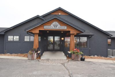 Vandy's Grille entrance painted charcoal with natural wood timber columns and trim